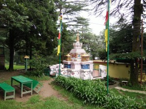 A stupa in the campus surrounded by trees