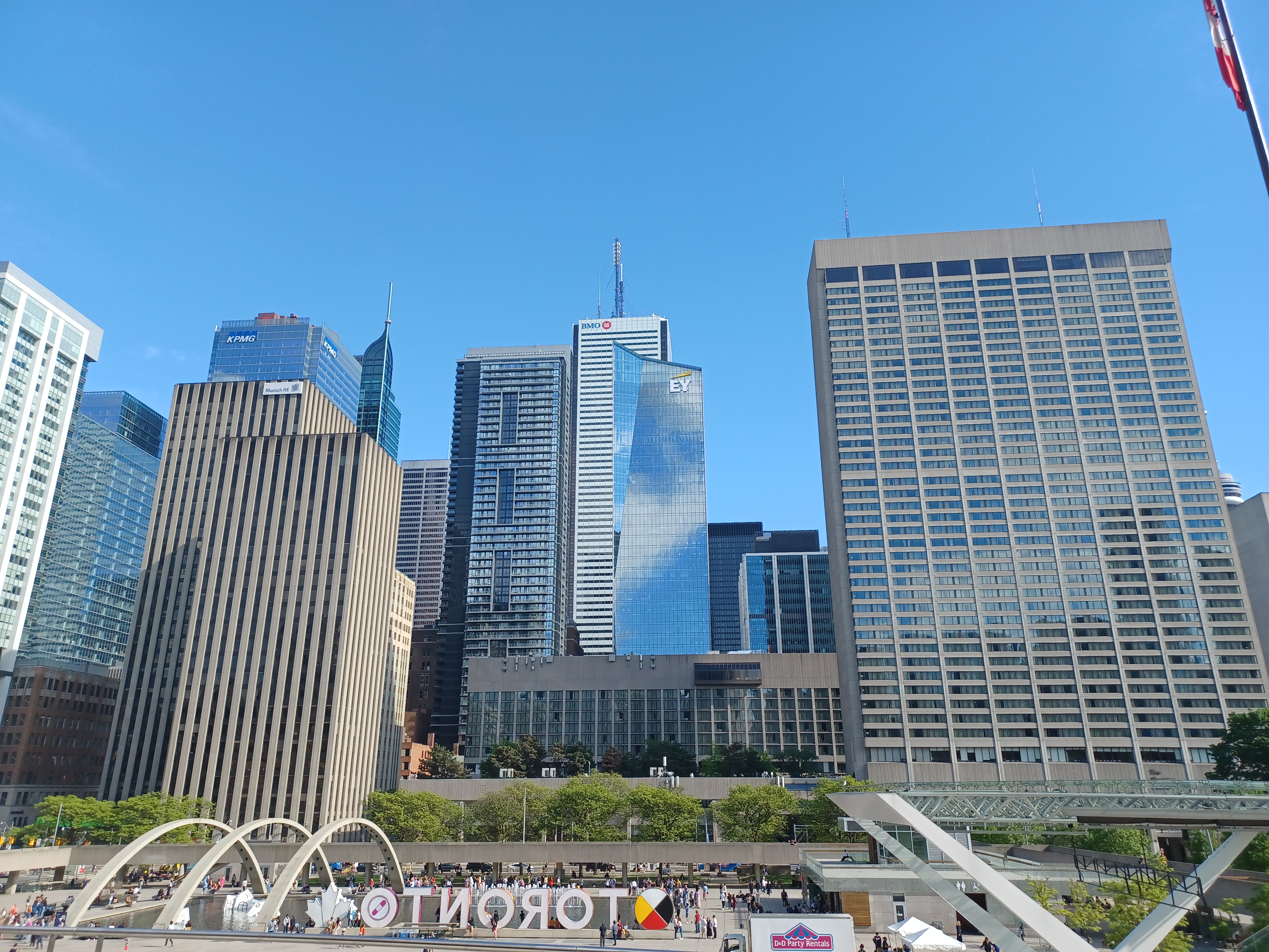 Two architectural styles are visible in this picture - the older concrete architecture at the front and the newer glass buildings in the back.