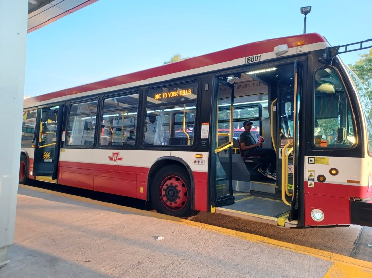The public buses and streetcars have accessibility built-in. The yellow outlined box on the floor of the bus door is the ramp that opens up when needed.