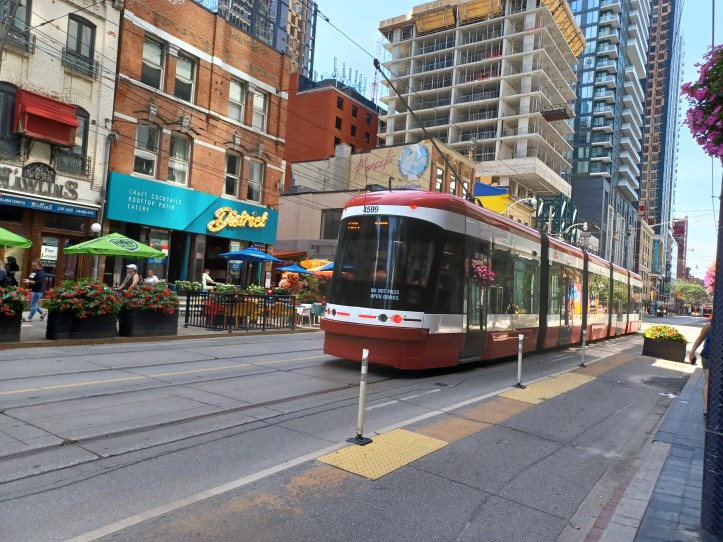 Toronto streetcars - they snake through busy neighborhoods and are a sight to behold. This pic was clicked outside the TIFF Bell Lightbox.
